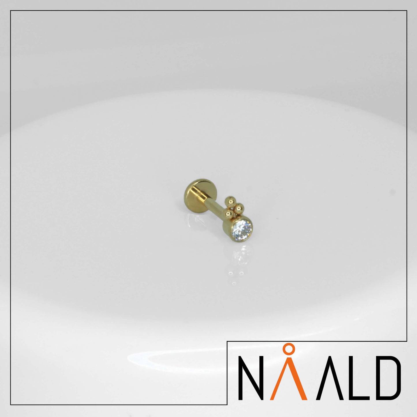 Piercing Labret avec brillant et billes finition PVD OR