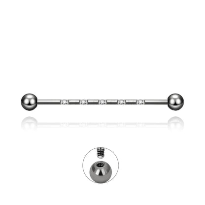 Barre piercing industriel Isidora en titane argenté avec cristaux de zirconium, fermeture en pas de vis externe.