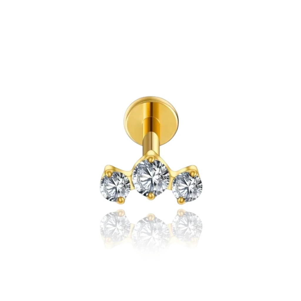 Piercing hélix Telma en titane ASTM F-136 PVD or avec trois zirconiums blancs